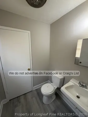 a bathroom with a toilet a sink and a bathtub