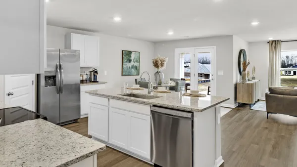 a kitchen with a sink stove and refrigerator