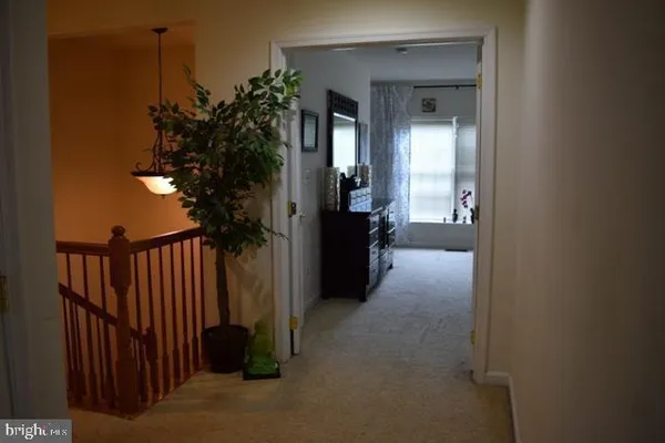 a view of a livingroom with furniture and window