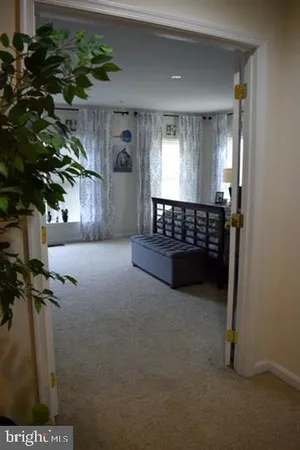 a bedroom with a bed and cabinet