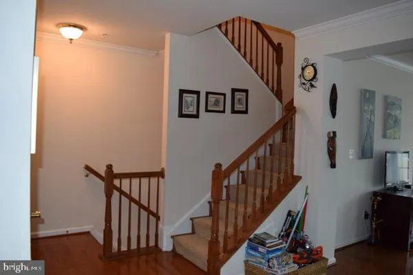 a view of entryway with wooden stairs