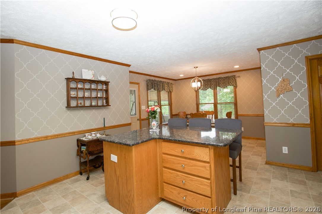 7815 Shuttle Road Fayetteville, NC 28311 - Photo 17 of 50 a view of a living room and workspace