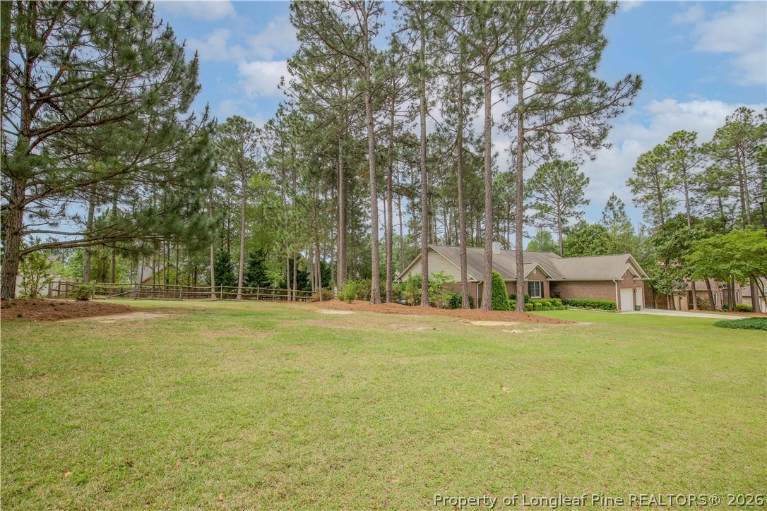 7815 Shuttle Road Fayetteville, NC 28311 - Photo 21 of 50 a front view of a house with a yard and trees