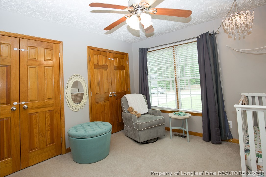7815 Shuttle Road Fayetteville, NC 28311 - Photo 25 of 50 a living room with furniture and a window
