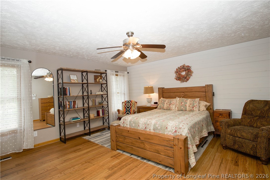 7815 Shuttle Road Fayetteville, NC 28311 - Photo 30 of 50 a bedroom with a bed furniture and decor