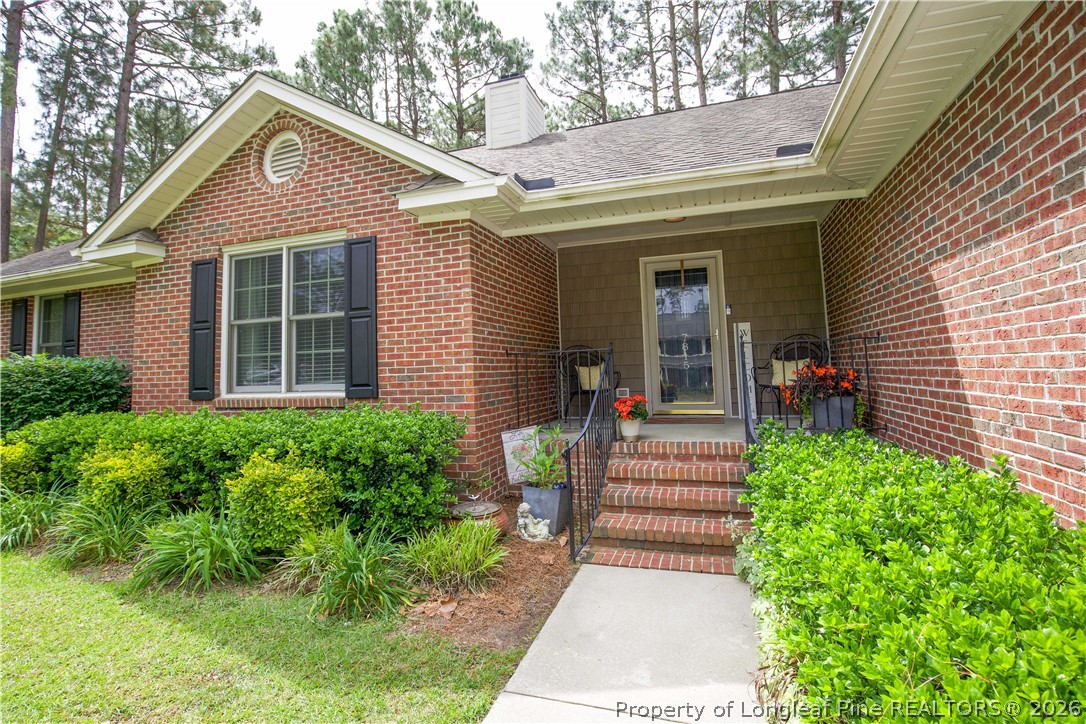 7815 Shuttle Road Fayetteville, NC 28311 - Photo 3 of 50 a front view of a house with a yard