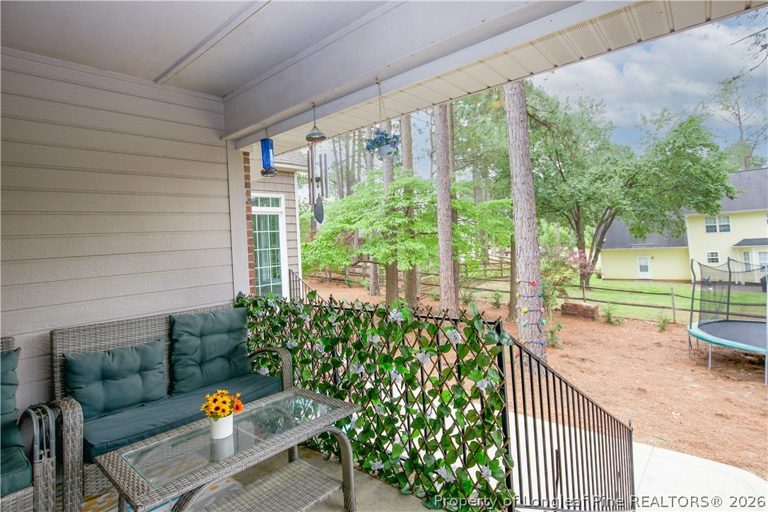 7815 Shuttle Road Fayetteville, NC 28311 - Photo 38 of 50 a view of a porch with furniture and garden
