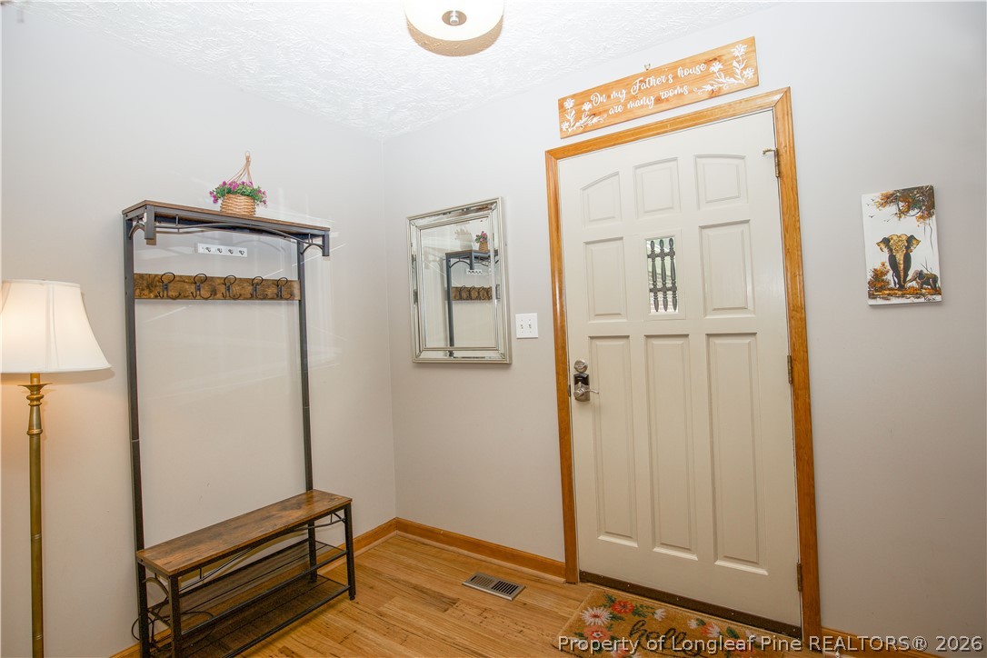 7815 Shuttle Road Fayetteville, NC 28311 - Photo 4 of 50 a room with wooden floor and a window