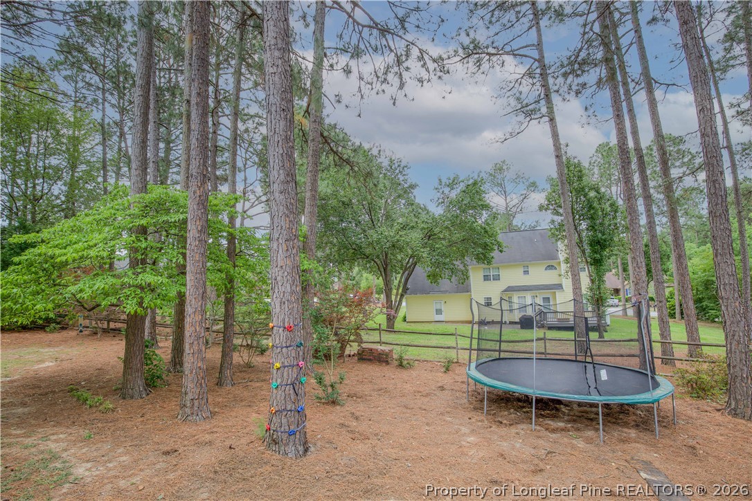 7815 Shuttle Road Fayetteville, NC 28311 - Photo 41 of 50 a view of a swimming pool with a patio and a yard