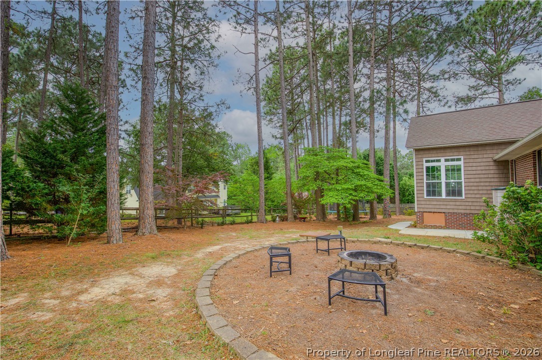 7815 Shuttle Road Fayetteville, NC 28311 - Photo 44 of 50 a backyard of a house with seating space