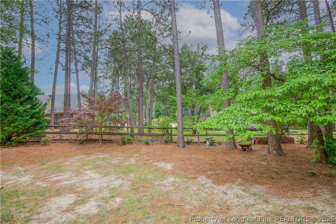 7815 Shuttle Road Fayetteville, NC 28311 - Photo 46 of 50 a view of a fire pit with large trees