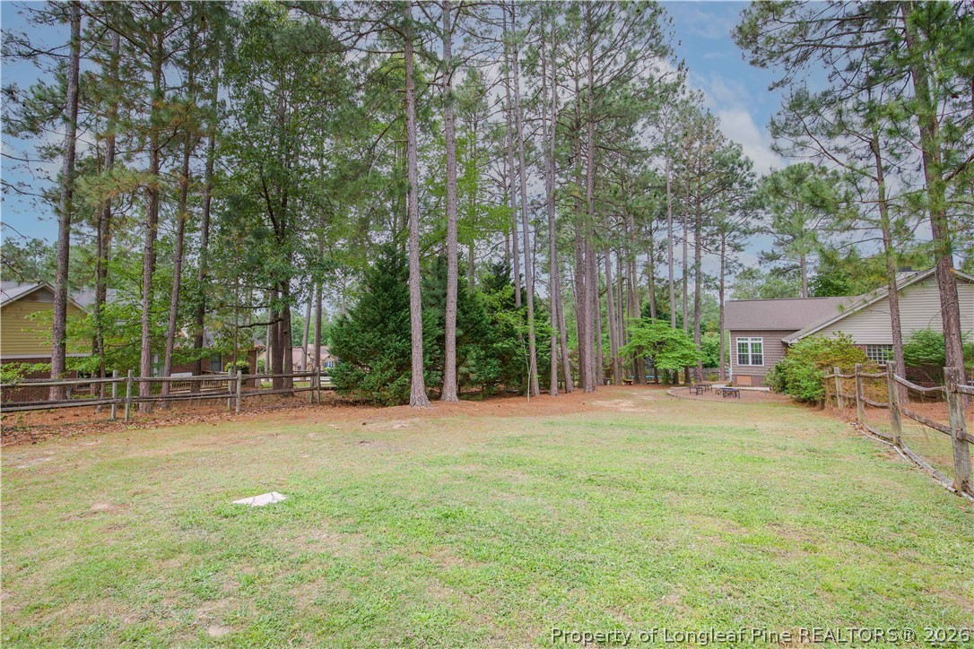 7815 Shuttle Road Fayetteville, NC 28311 - Photo 48 of 50 a backyard of a house with table and chairs