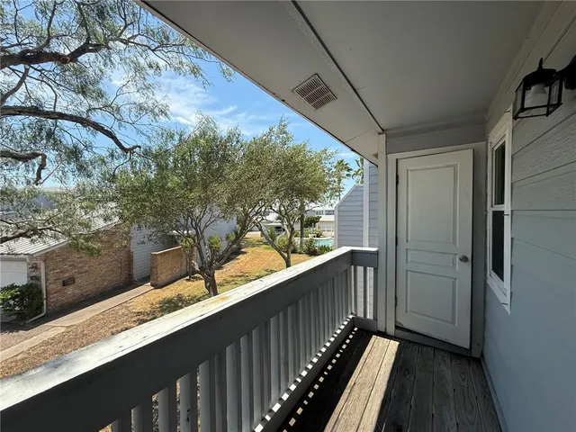 a balcony with wooden floor