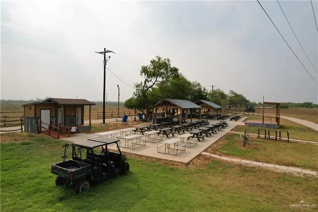 a view of a swimming pool with a table and chairs