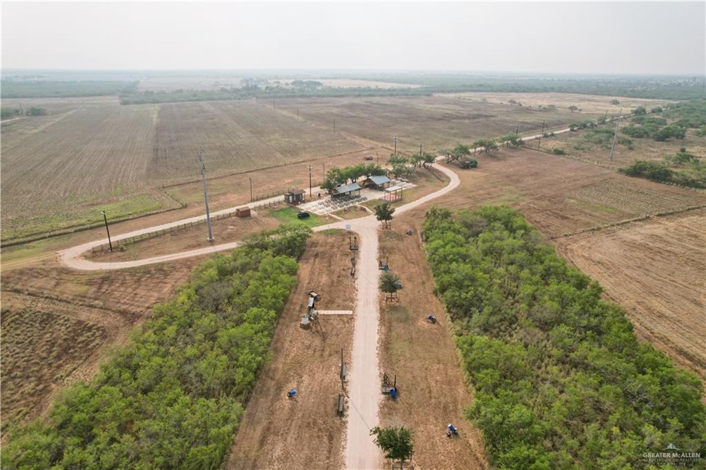 24059 Floral Road Edinburg, TX 78541 - Photo 4 of 7 a view of a lake with a yard