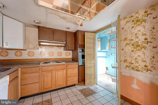 a view of a kitchen with cabinets