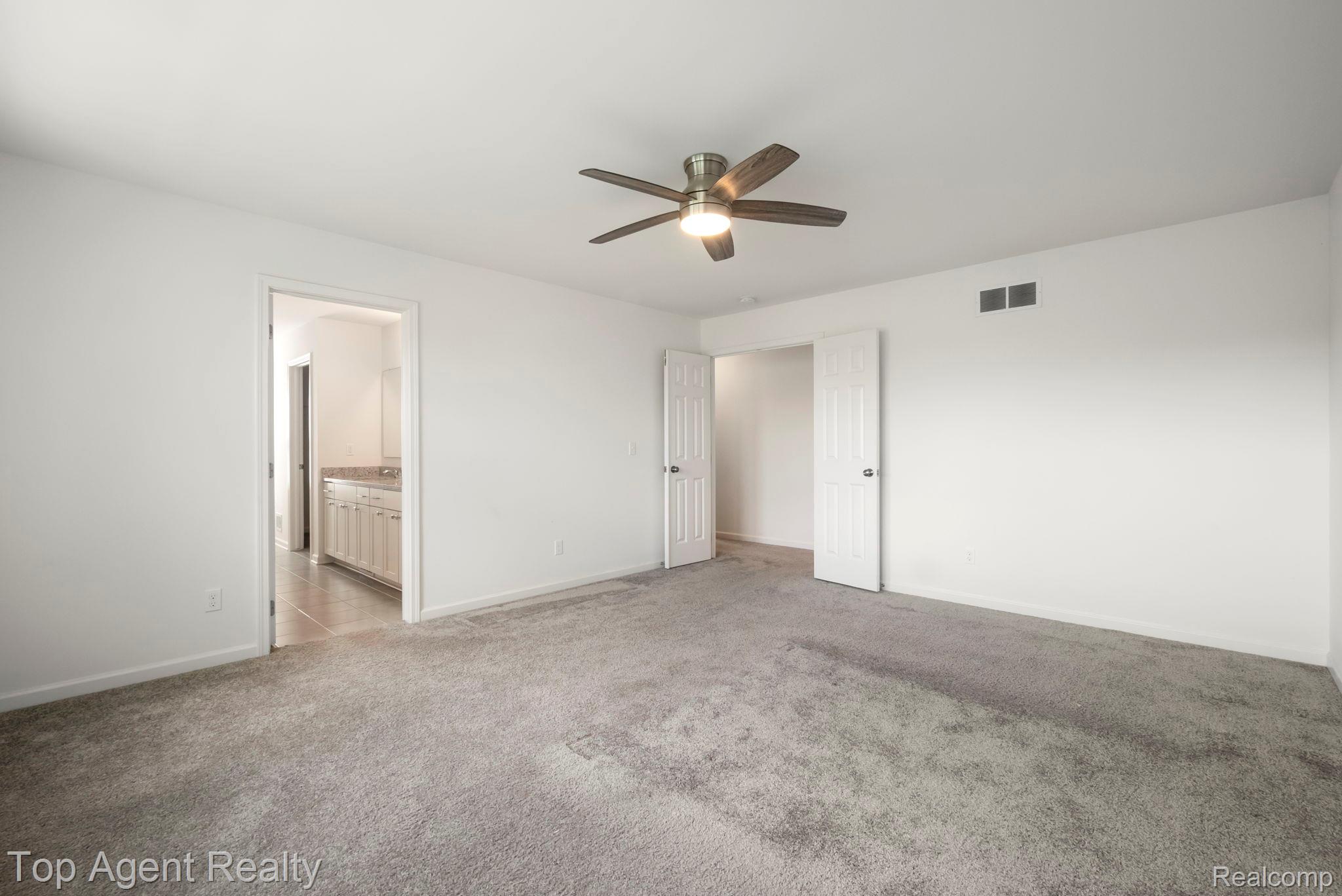 63770 Dequindre Road Washington, MI 48095 - Photo 42 of 61 Spacious room featuring neutral carpeting and white painted walls