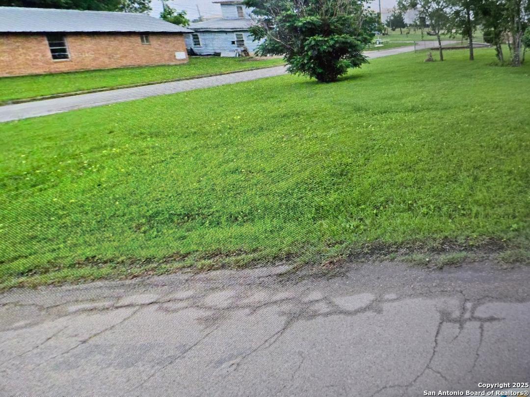 209 East 3rd Rockdale, TX 76567 - Photo 7 of 10 a view of a yard with an house