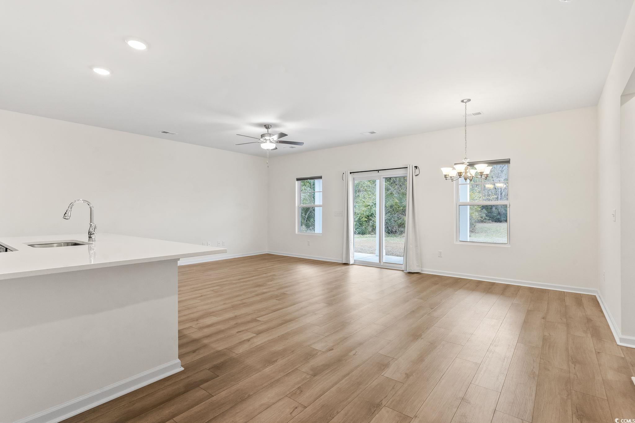 4115 Highway 19 Conway, SC 29526 - Photo 10 of 40 Another angle capturing the room’s generous size, neutral color palette, and easy furniture placement.