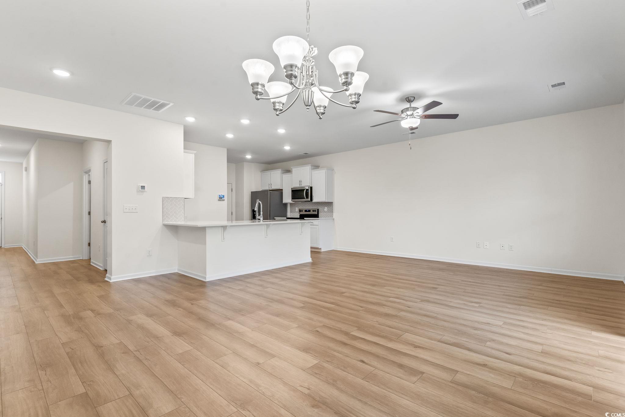 4115 Highway 19 Conway, SC 29526 - Photo 13 of 40 Open dining space positioned between the kitchen and living room, offering room for a full dining set.