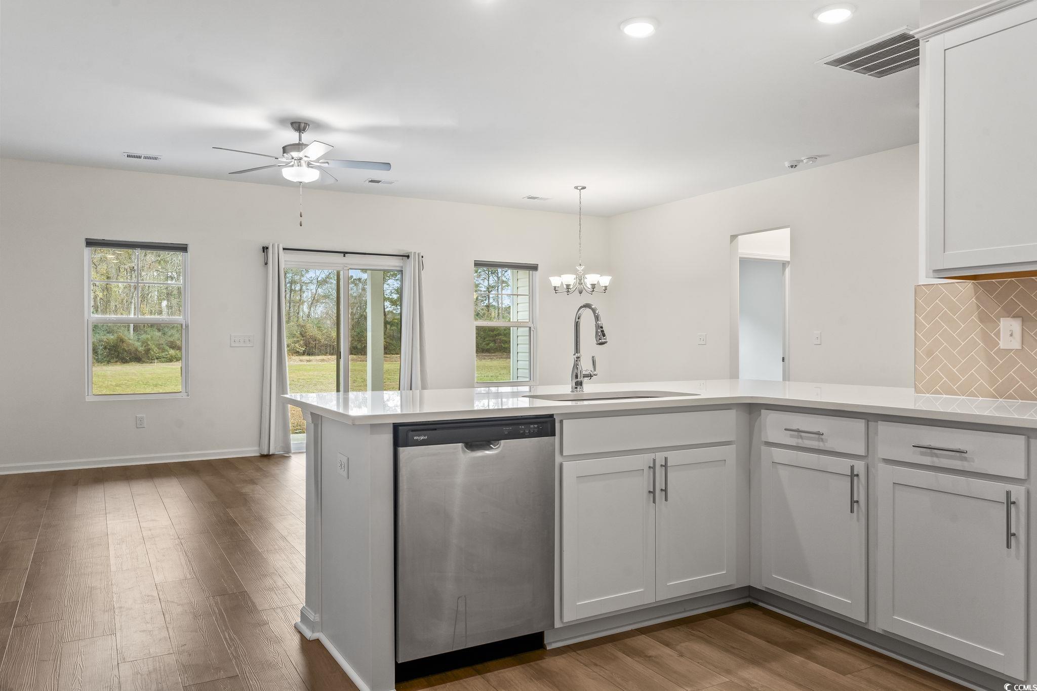4115 Highway 19 Conway, SC 29526 - Photo 19 of 40 Shows how the kitchen connects to the dining area, offering a natural flow throughout the main living space.