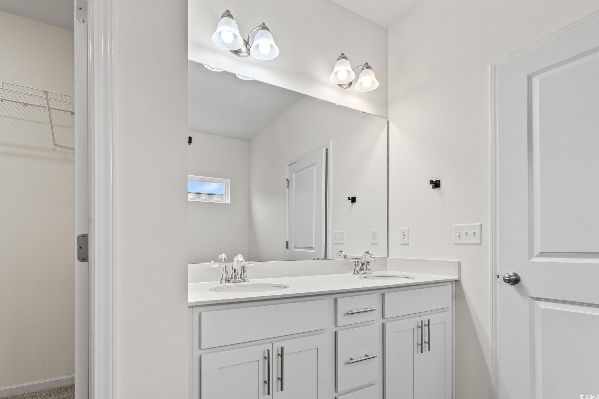 4115 Highway 19 Conway, SC 29526 - Photo 26 of 40 Angle capturing the double quartz vanity with large mirror