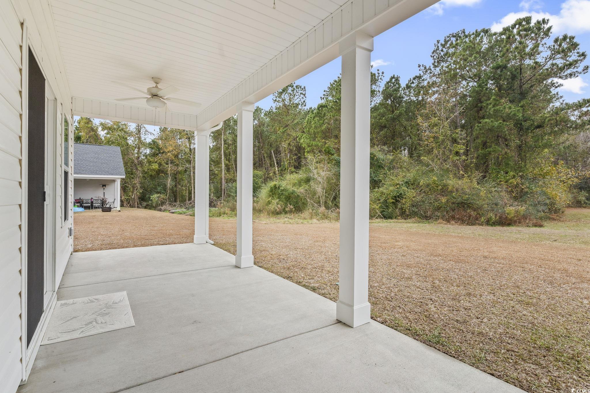 4115 Highway 19 Conway, SC 29526 - Photo 37 of 40 Large covered porch with ceiling fan, perfect for outdoor seating and overlooking the private 1.4 acres