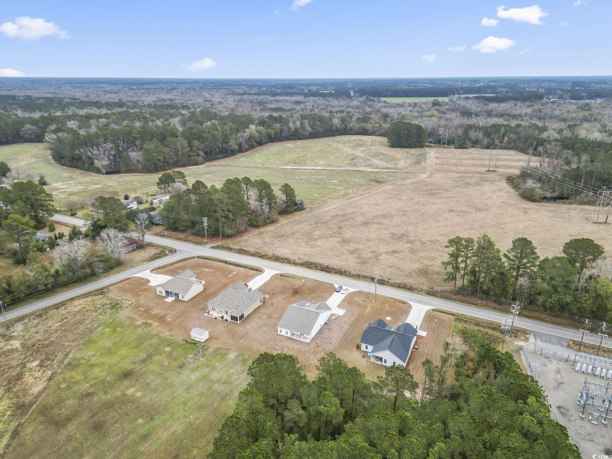 4115 Highway 19 Conway, SC 29526 - Photo 5 of 40 Wide-angle shot displaying the peaceful rural surroundings and spacious placement of neighboring properties