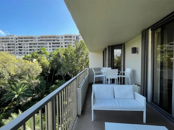 a view of balcony with furniture