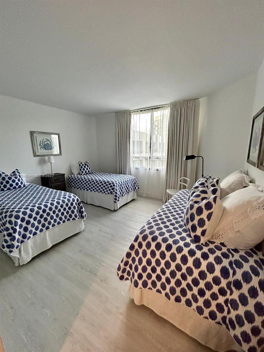101 Crandon Boulevard, Unit 473 Key Biscayne, FL 33149 - Photo 17 of 24 a bedroom with a bed and window