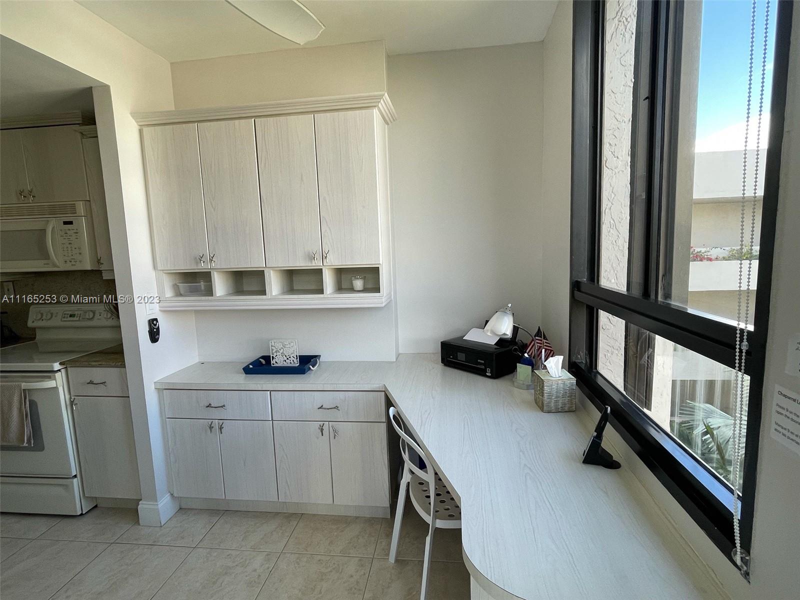 101 Crandon Boulevard, Unit 473 Key Biscayne, FL 33149 - Photo 4 of 24 a view of a kitchen with appliances and cabinets