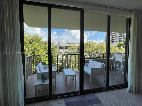 a view of a glass door and porch