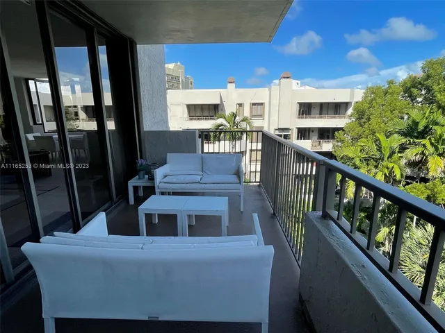 a view of a balcony and chairs