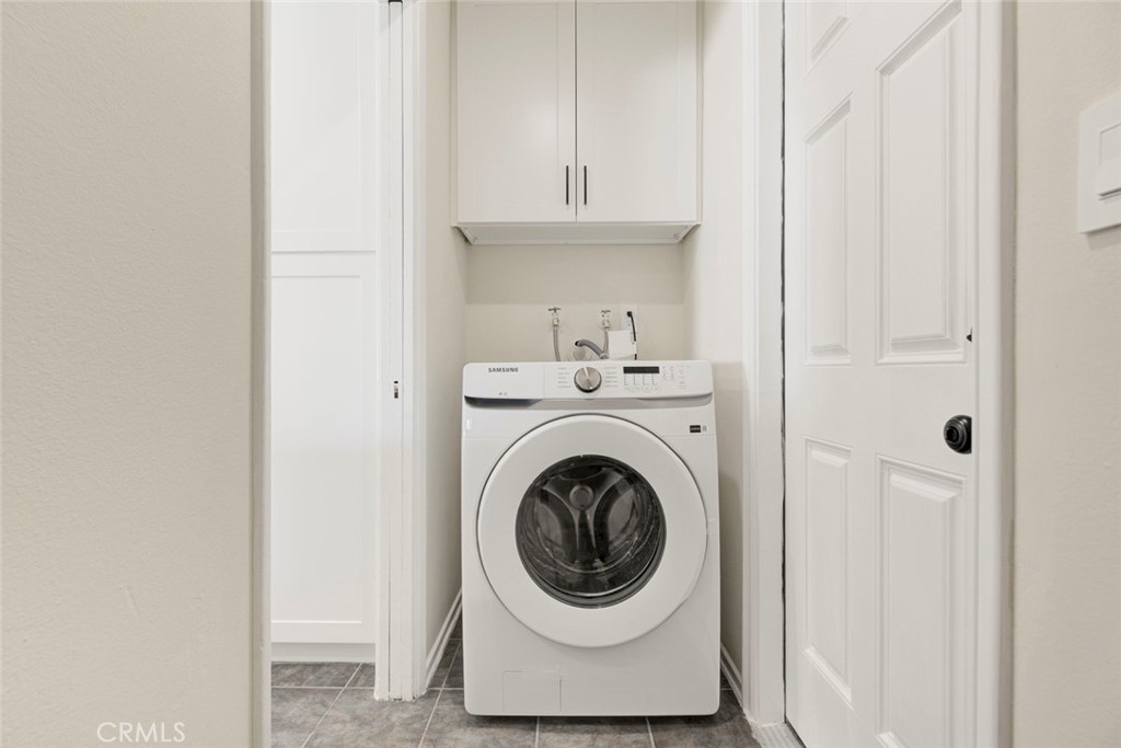 11369 Darby Avenue Porter Ranch, CA 91326 - Photo 20 of 56 a utility room with dryer and washer
