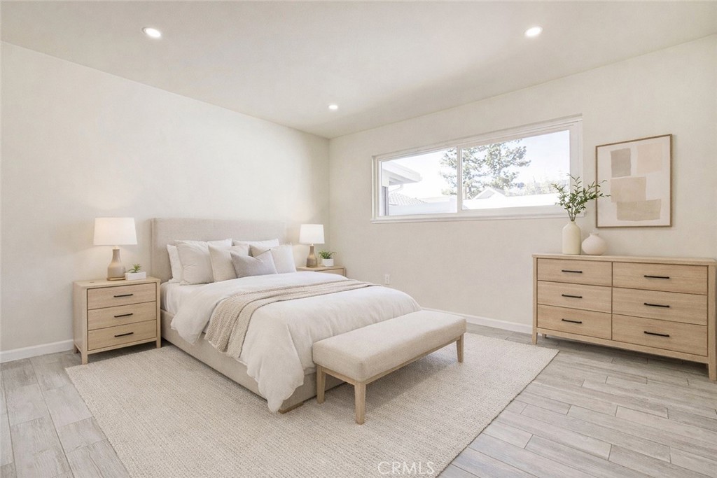 11369 Darby Avenue Porter Ranch, CA 91326 - Photo 27 of 56 a bedroom with a bed and window