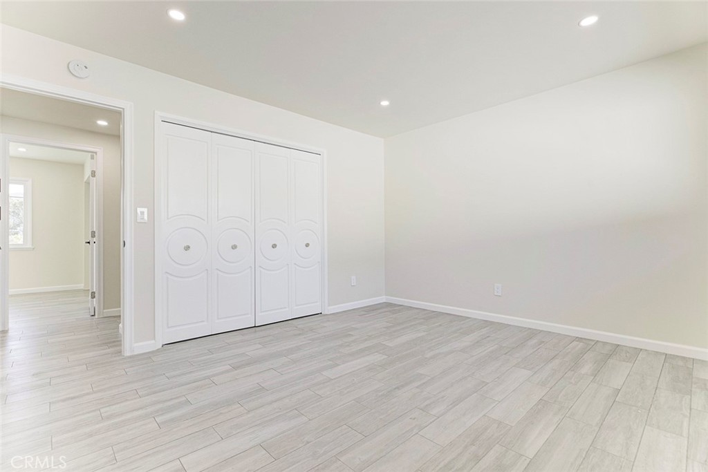 11369 Darby Avenue Porter Ranch, CA 91326 - Photo 30 of 56 wooden floor in an empty room with wooden floor
