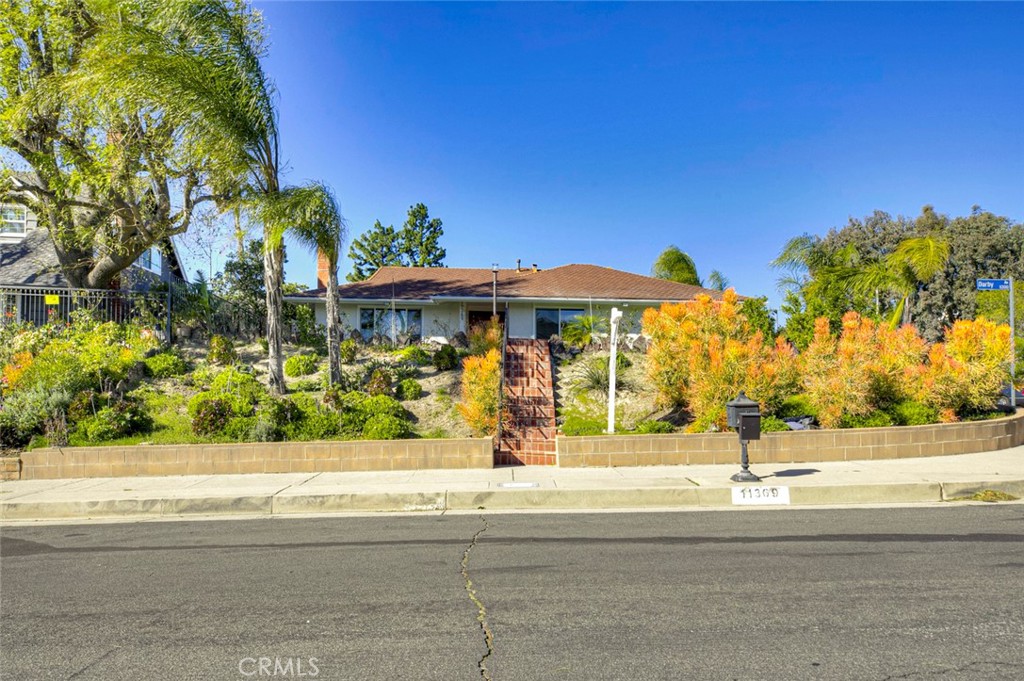 11369 Darby Avenue Porter Ranch, CA 91326 - Photo 39 of 56 a view of street with flower plants