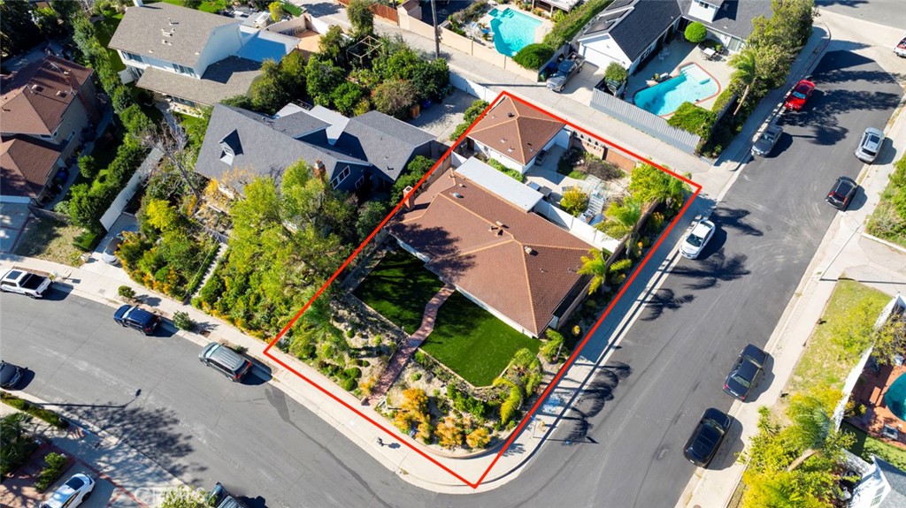 11369 Darby Avenue Porter Ranch, CA 91326 - Photo 43 of 56 an aerial view of a house with a garden and swimming pool