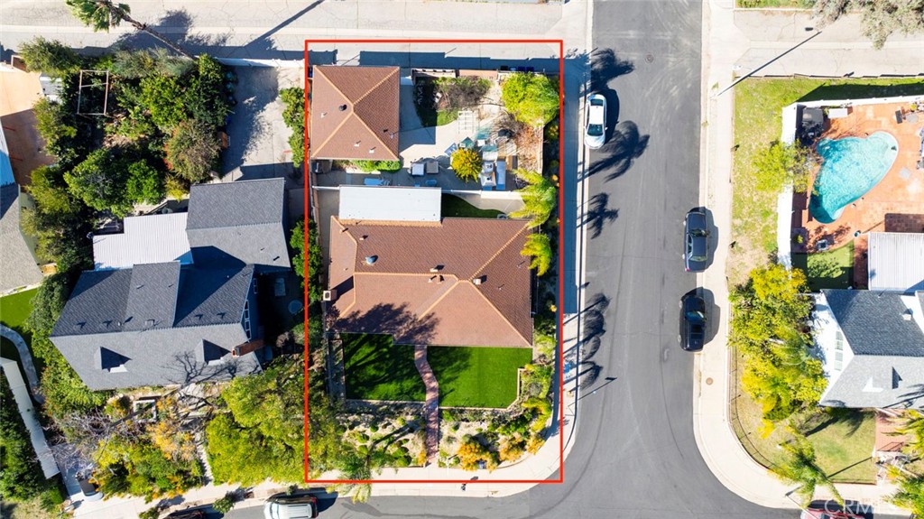 11369 Darby Avenue Porter Ranch, CA 91326 - Photo 44 of 56 an aerial view of a house with swimming pool and garden