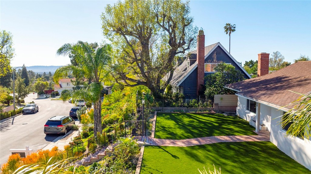 11369 Darby Avenue Porter Ranch, CA 91326 - Photo 49 of 56 a view of a backyard with plants and a patio