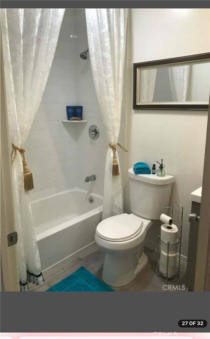 11369 Darby Avenue Porter Ranch, CA 91326 - Photo 55 of 56 a white toilet sitting next to a bath tub