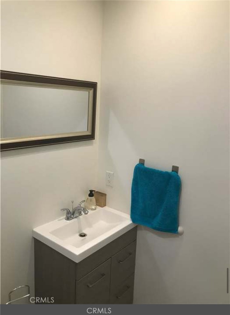 11369 Darby Avenue Porter Ranch, CA 91326 - Photo 56 of 56 a bathroom with a sink and a mirror