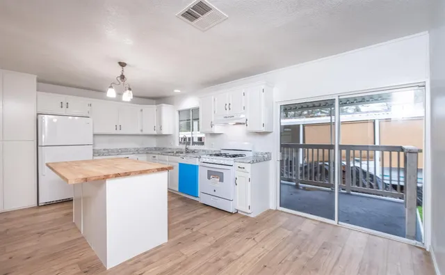 a bathroom with a bathtub shower sink and a mirror