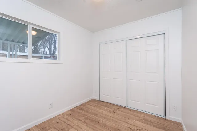 a view of backyard with outdoor seating and green space