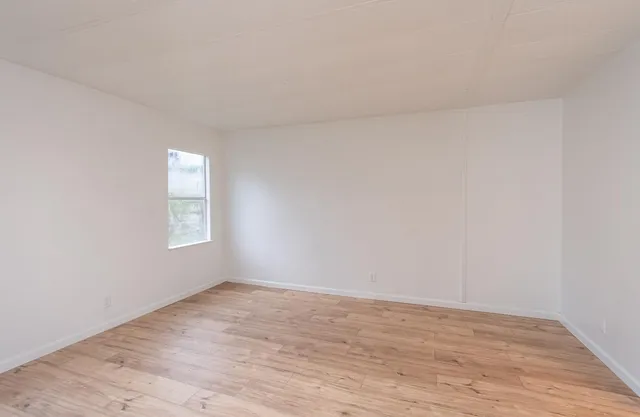 an aerial view of a yard with a barn