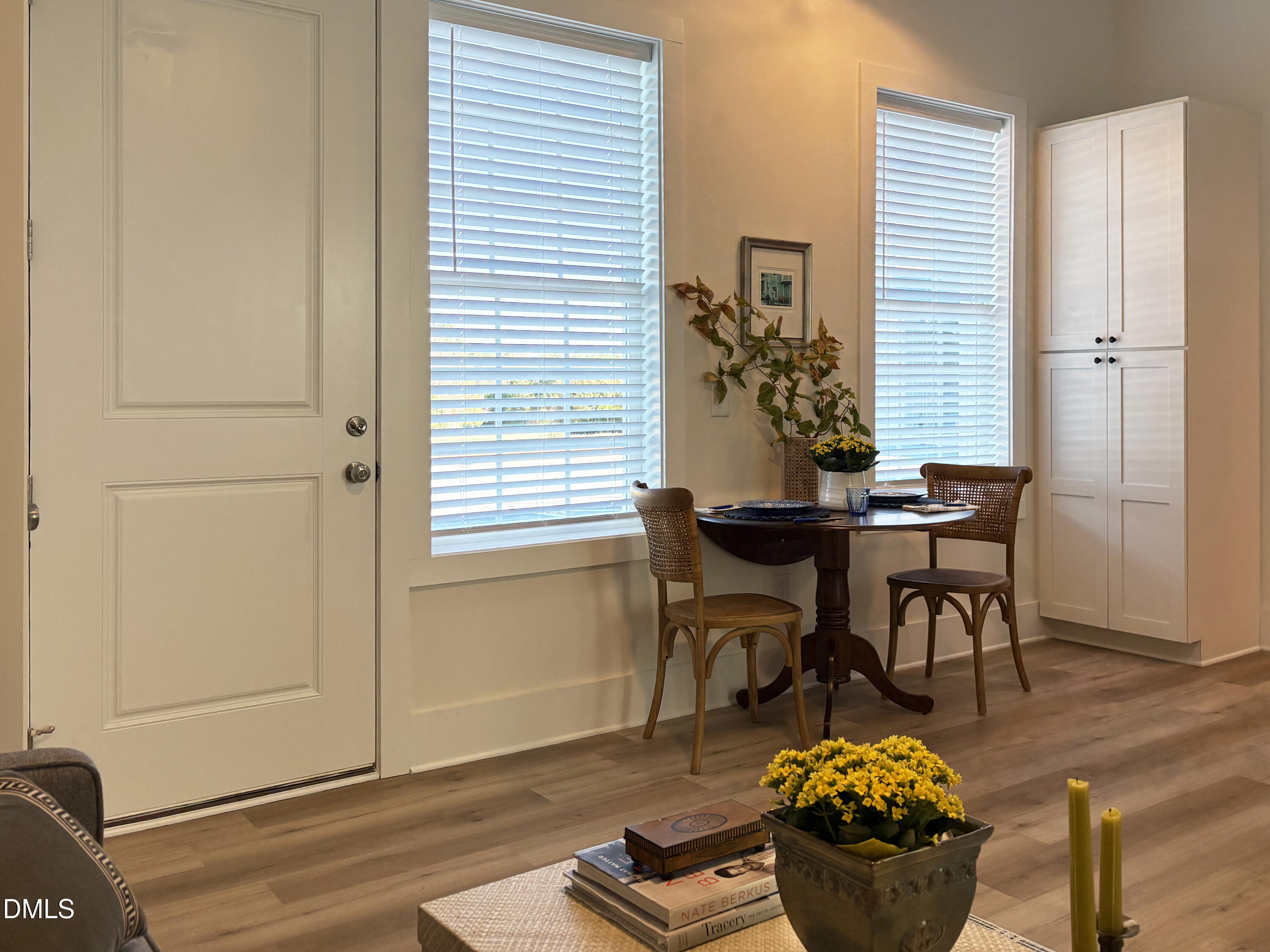 110 Bellamy Lane, Unit 202 Chapel Hill, NC 27516 - Photo 7 of 22 a view of a dining room with furniture and wooden floor