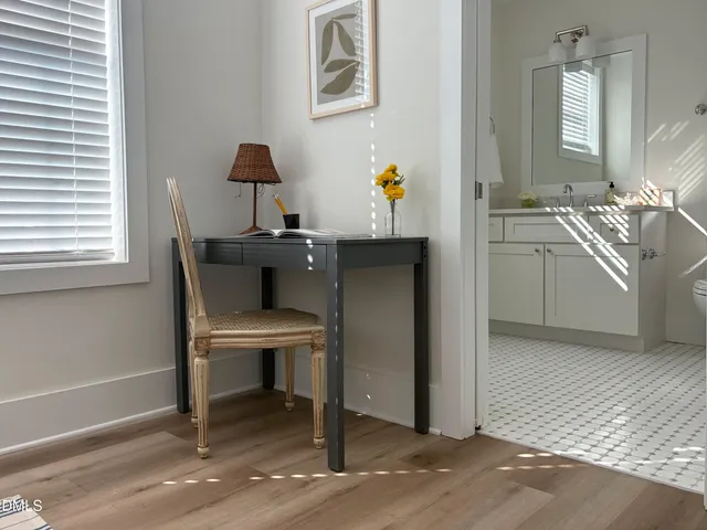 a workspace with furniture and window