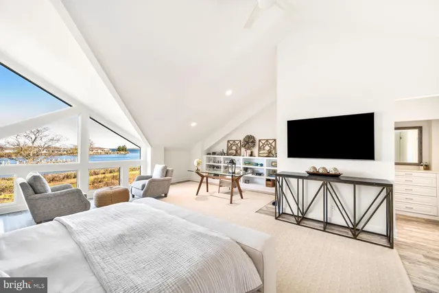 a view of a livingroom with furniture and flat screen tv