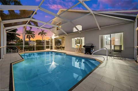 a view of a swimming pool with a patio