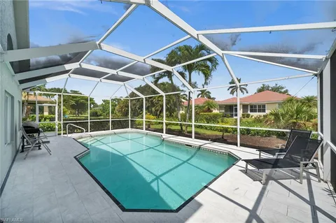 a view of a patio with a table and chairs